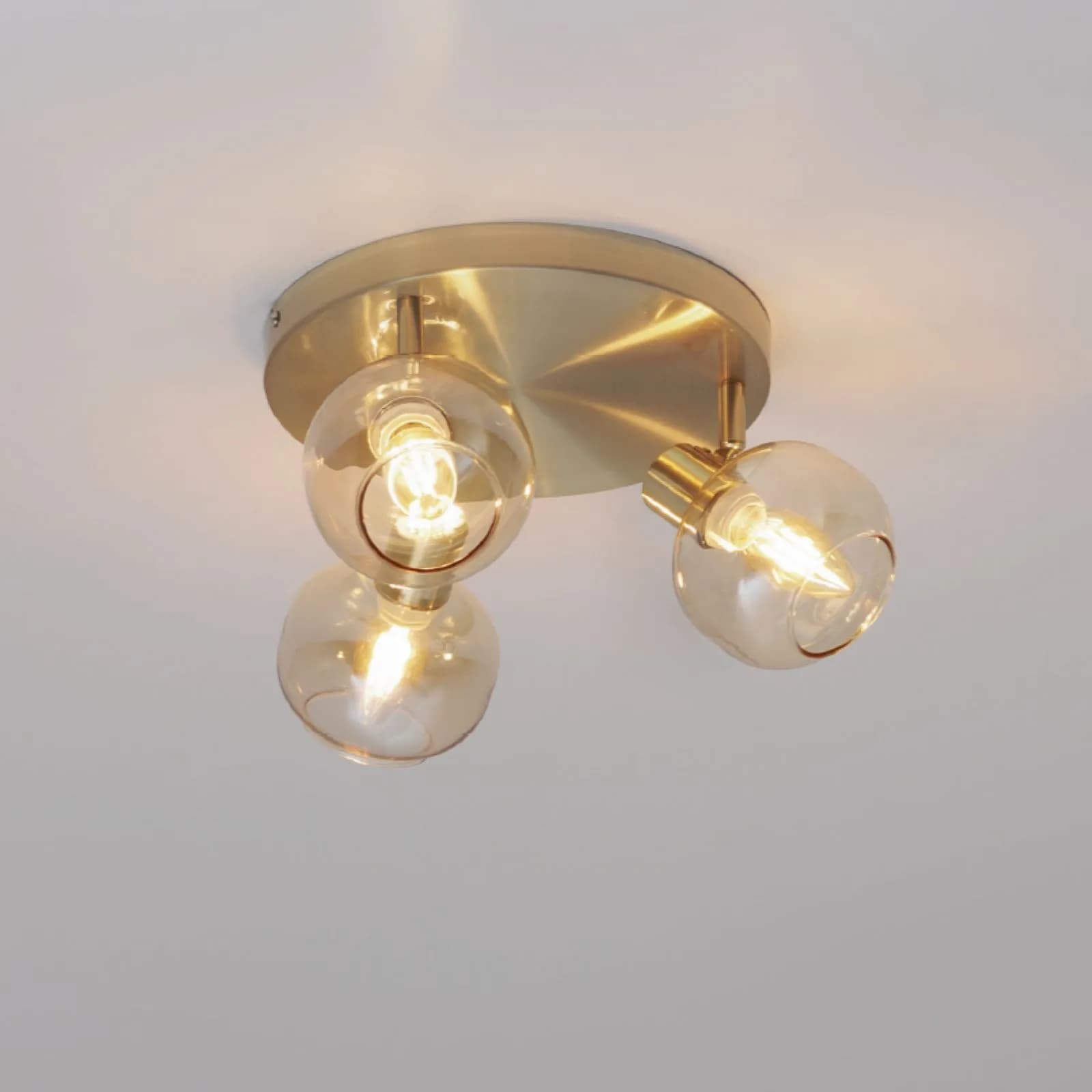 Lampada 3 spot orientabili 25x16h cm in acciaio oro e vetro ambrato - Valdes