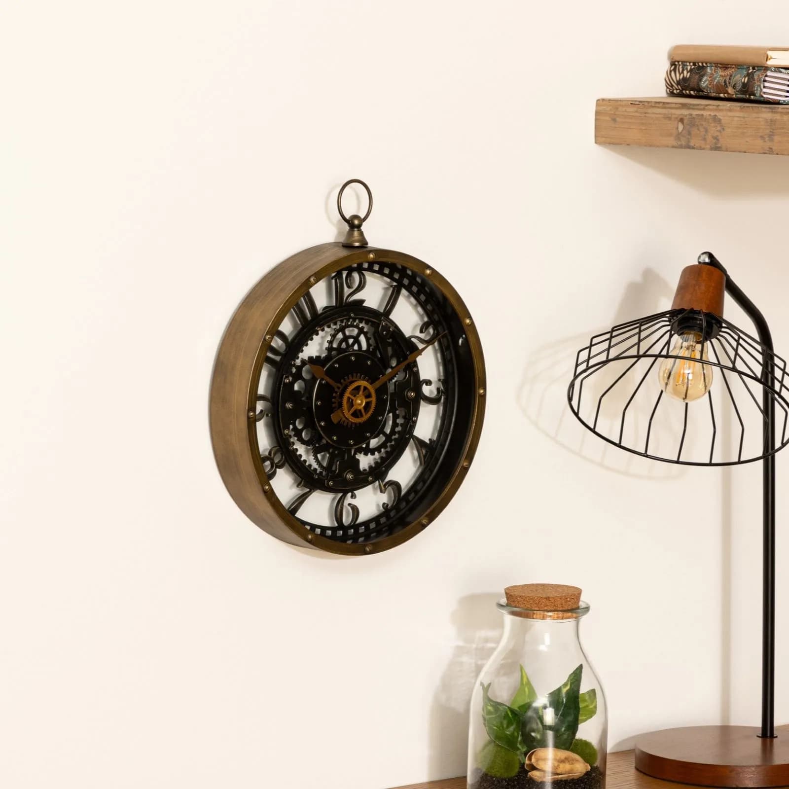 Orologio rotondo 27 cm effetto metallo anticato oro e nero